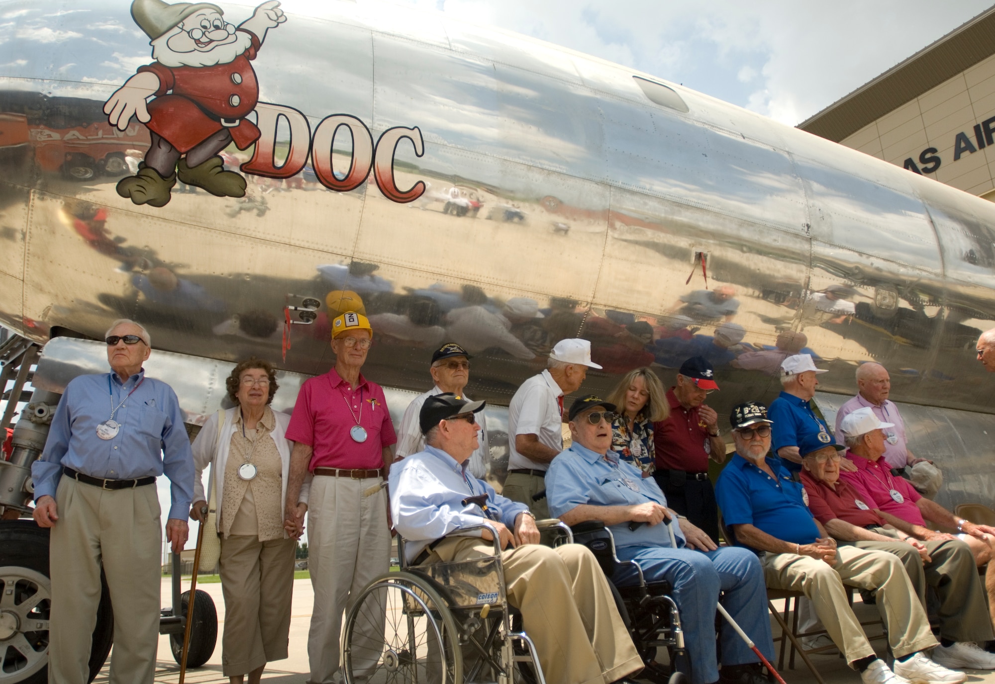 Members of the 73rd Bomb Wing Association gather around a B-29 Superfortress at the Kansas Air Museum for a photo during a base tour May 27, 2010, McConnell Air Force Base, Kan.  The 73rd BW Association is an unincorporated, non-profit organization of individuals that either served with the 73rd BW during World War II, or are the widow or a family member of such veterans, who meet, associate, revisit and operate to promote the accomplishments, activities and history of the 73rd BW during WWII, to help preserve and protect its memorabilia. (U.S. Air Force photo/Senior Airman Abigail Klein)