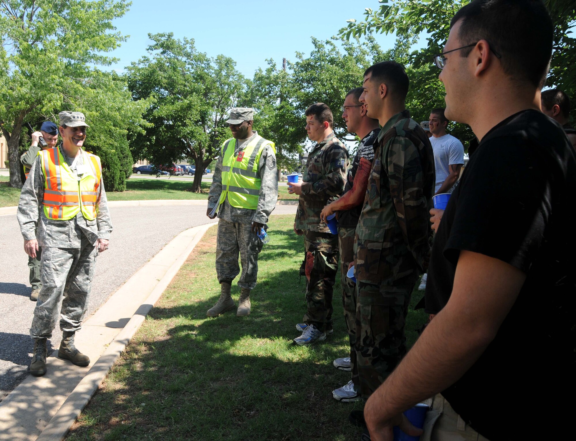 ALTUS AIR FORCE BASE, Okla. -- General Stephen Lorenz, Commander of Air Education and Training Command, personally thanks the role players who participated in the force protection exercise June 1. This exercise was conducted in order to train base personnel on how to respond and recover from mass casualty incidents. U.S. Air Force photo / Senior Airman Cherice Bryant / Released / 97th Air Mobility Wing Public Affairs)