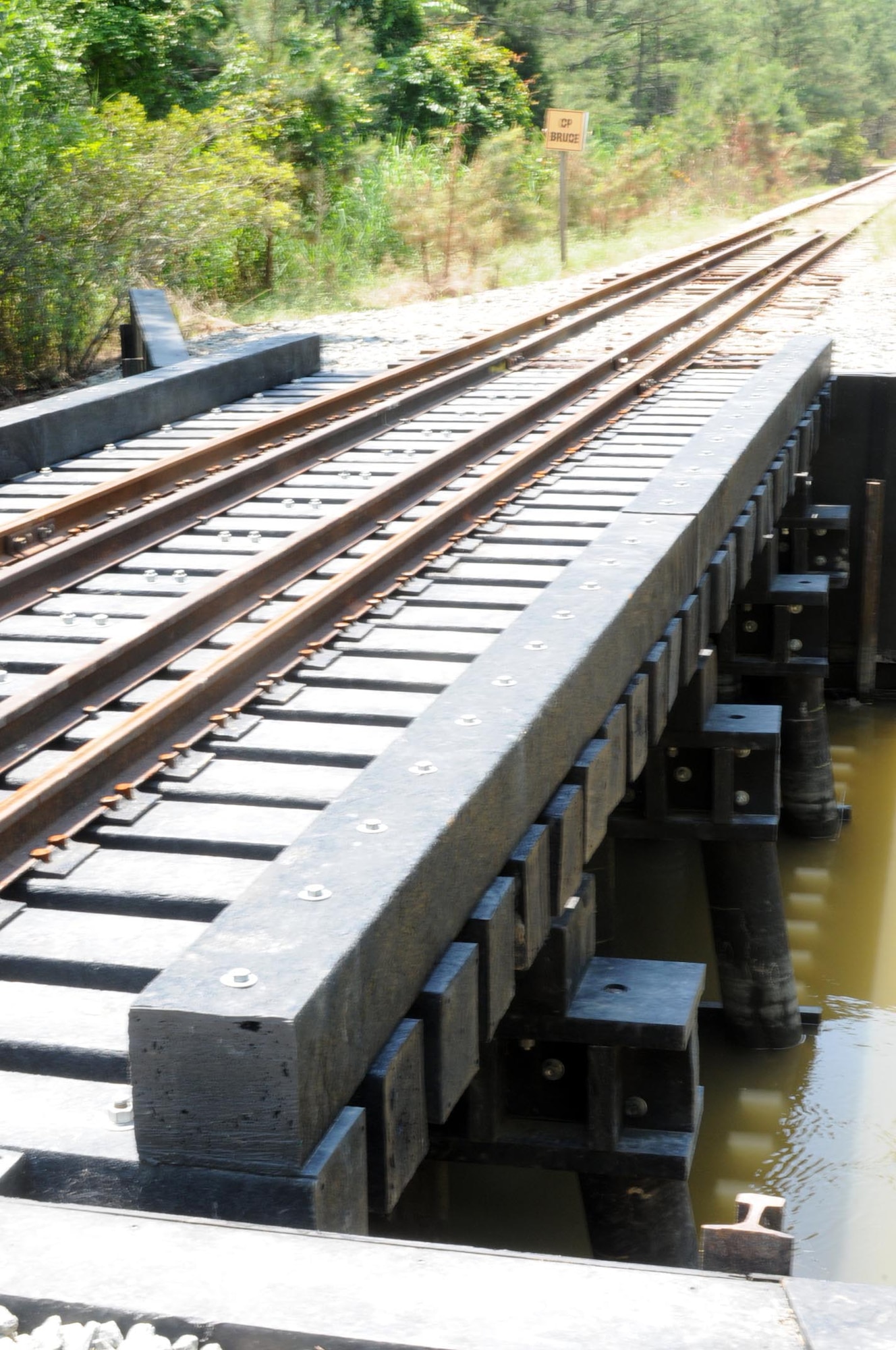FORT EUSTIS, Va. -- The former wooden Bridge #3, along with Bridge #7, was replaced this month with a Recycled Structural Composite bridge. The former bridges had aged to a point of concern in supporting the engines and rolling stock used by the U.S. Army Transportation School during training. (U.S. Air Force photo/Tetaun Moffett)