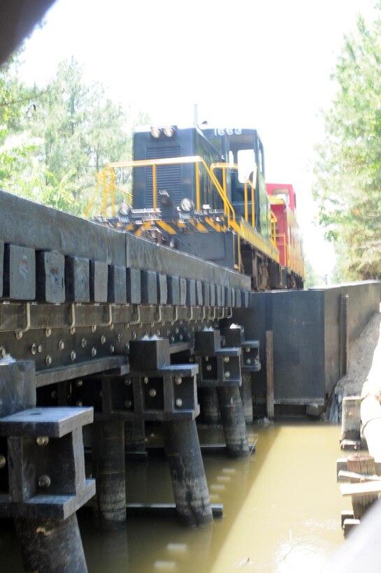 FORT EUSTIS, Va. -- The locomotive and caboose makes its way back across Bridge #3 as it departs. The bridge was made to E60 weight and speed limit standards.   
 (U.S. Air Force photo/Tetaun Moffett)