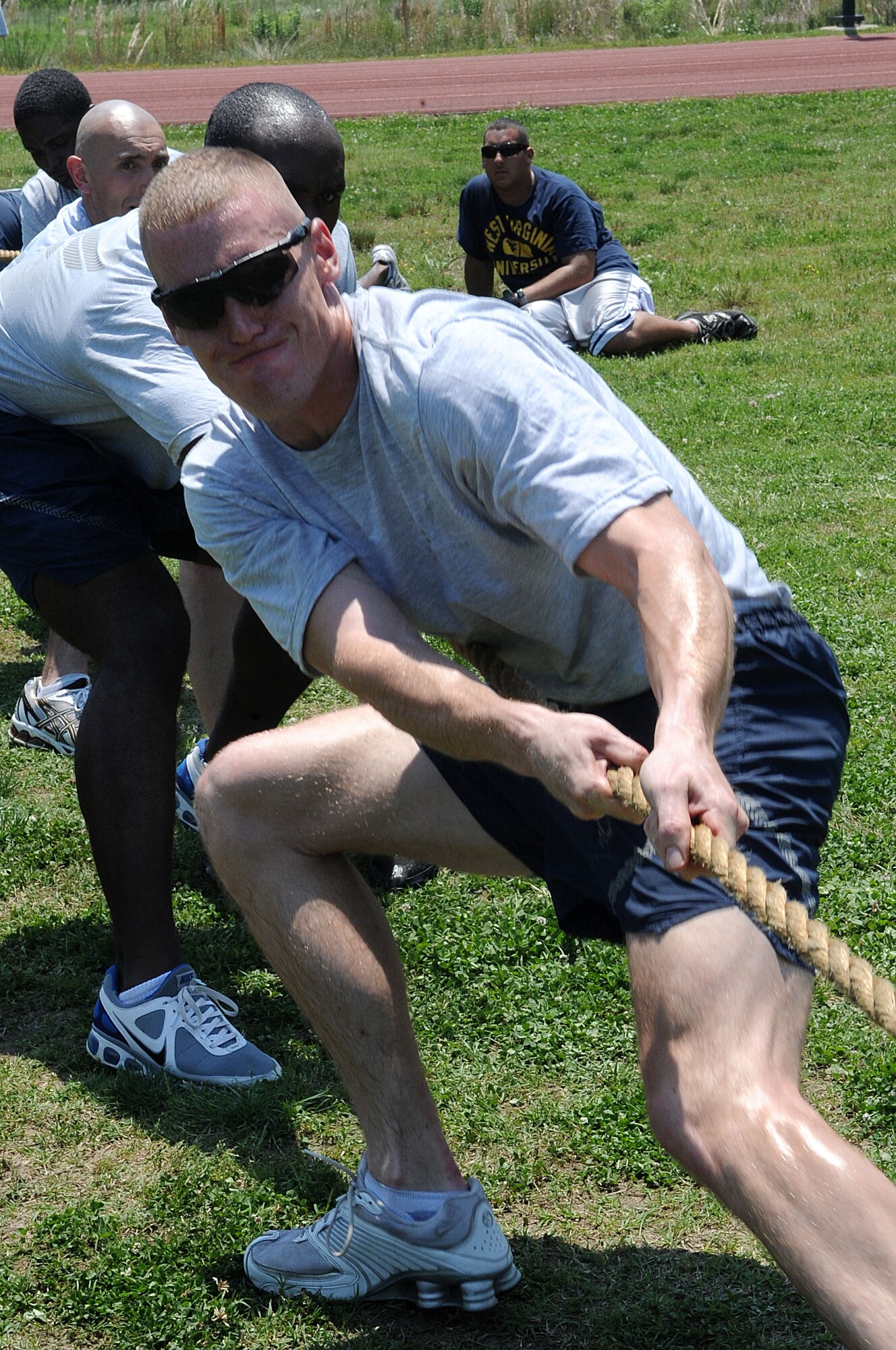 LANGLEY AIR FORCE BASE, Va. -- Staff Sgt. Brandon Phelps, 633d Security Forces Squadron unit training instructor, and his team participate in and take the tug-o-war title during the Squadron Fitness Challenge May 27. Eighteen teams participated in the annual event wrapping up May fitness month, hosted by the 633d Force Support Squadron and Prism Sports to promote a healthy, active lifestyle.  (U.S. Air Force Photo/Staff Sgt. Christina M. Styer)         