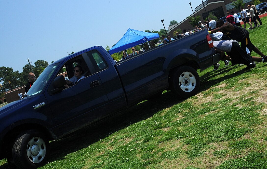 LANGLEY AIR FORCE BASE, Va. -- Members of the 735th Supply Chain Management Group team participate in the Squadron Fitness Challenge hosted by 633d Force Support Squadron and Prism Sports May 27.  Eighteen teams participated in the annual event wrapping up May fitness month to promote a healthy, active lifestyle.  (U.S. Air Force Photo/Staff Sgt. Christina M. Styer) 