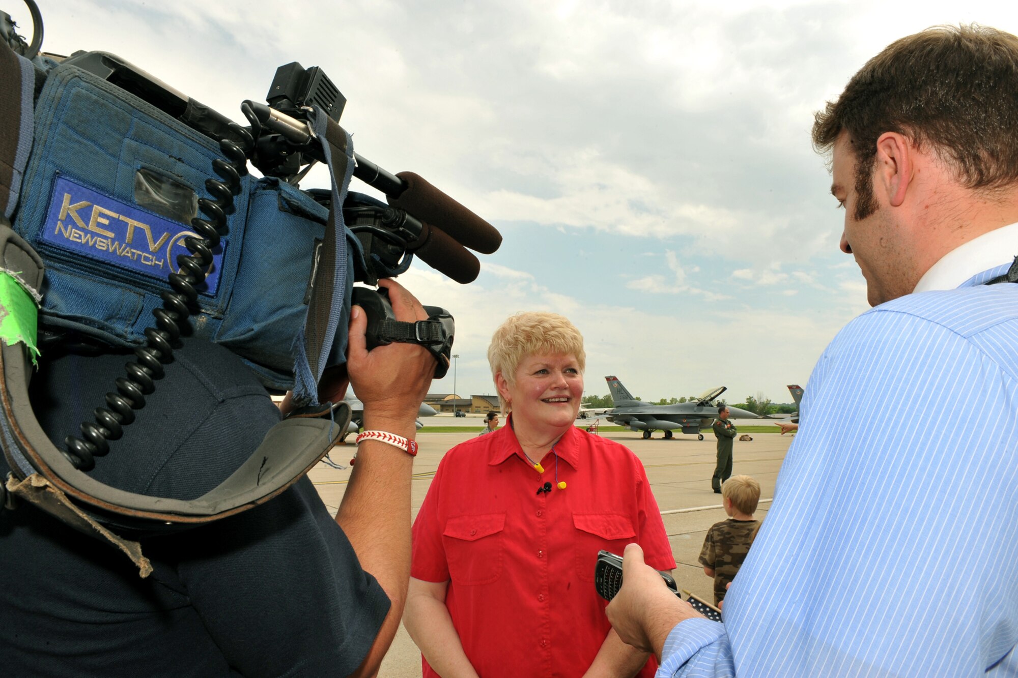 OFFUTT AIR FORCE BASE, Neb. -- Local news casters interview Nancy Frazier, the mother of Lt. Col. Bradley Frazier, 388th Fighter Wing from Hill AFB, Utah, here May 26 about her sons' return from a recent deployment to Afghanistan. The colonel stopped at Offutt to rest before traveling to Hill AFB. U.S. Air Force Photo by Charles Haymond