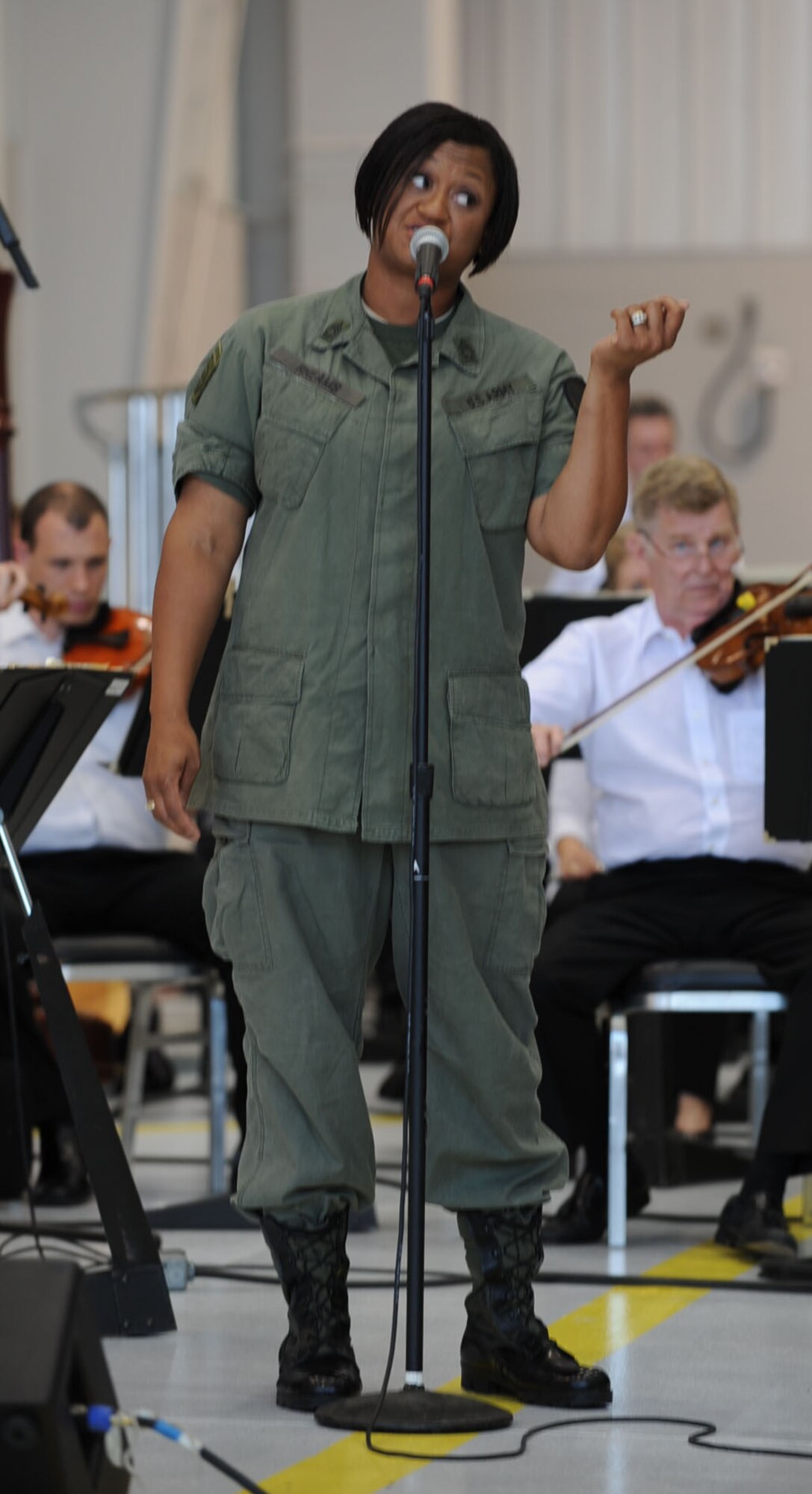 SEYMOUR JOHNSON AIR FORCE BASE, N.C. -- Army Sgt. Christal Sanders Rheams performs with the North Carolina Symphony during their Red White & Blue Tour here June 1, 2010. Sergeant Rheams is a vocalist from the United States Army Band and has shared the stage with stars like Wayne Newton, Ricky Martin and Trisha Yearwood. Sergeant Rheams is a native of Raleigh. (U.S. Air Force photo/Senior Airman Gino Reyes)