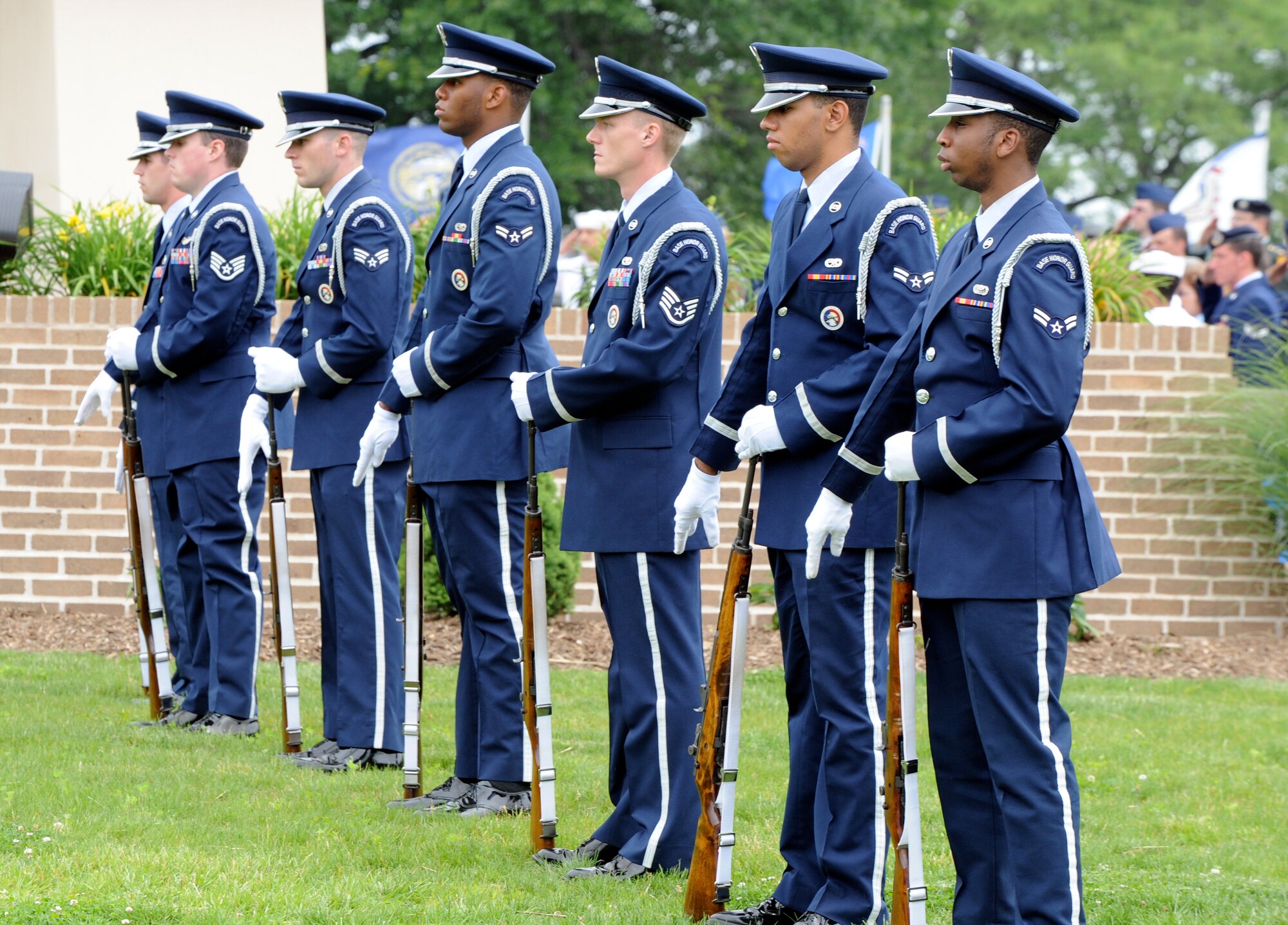 Members of the 87th Air Base Wing Honor Guard Rifle Team salutes as Taps is played following a 21-gun salute. A KC-10 Extender and C-17 Globemaster fly overhead during the annual Memorial Day Parade of Wreaths here May 27. (U.S. Air Force photo/Wayne Russell)