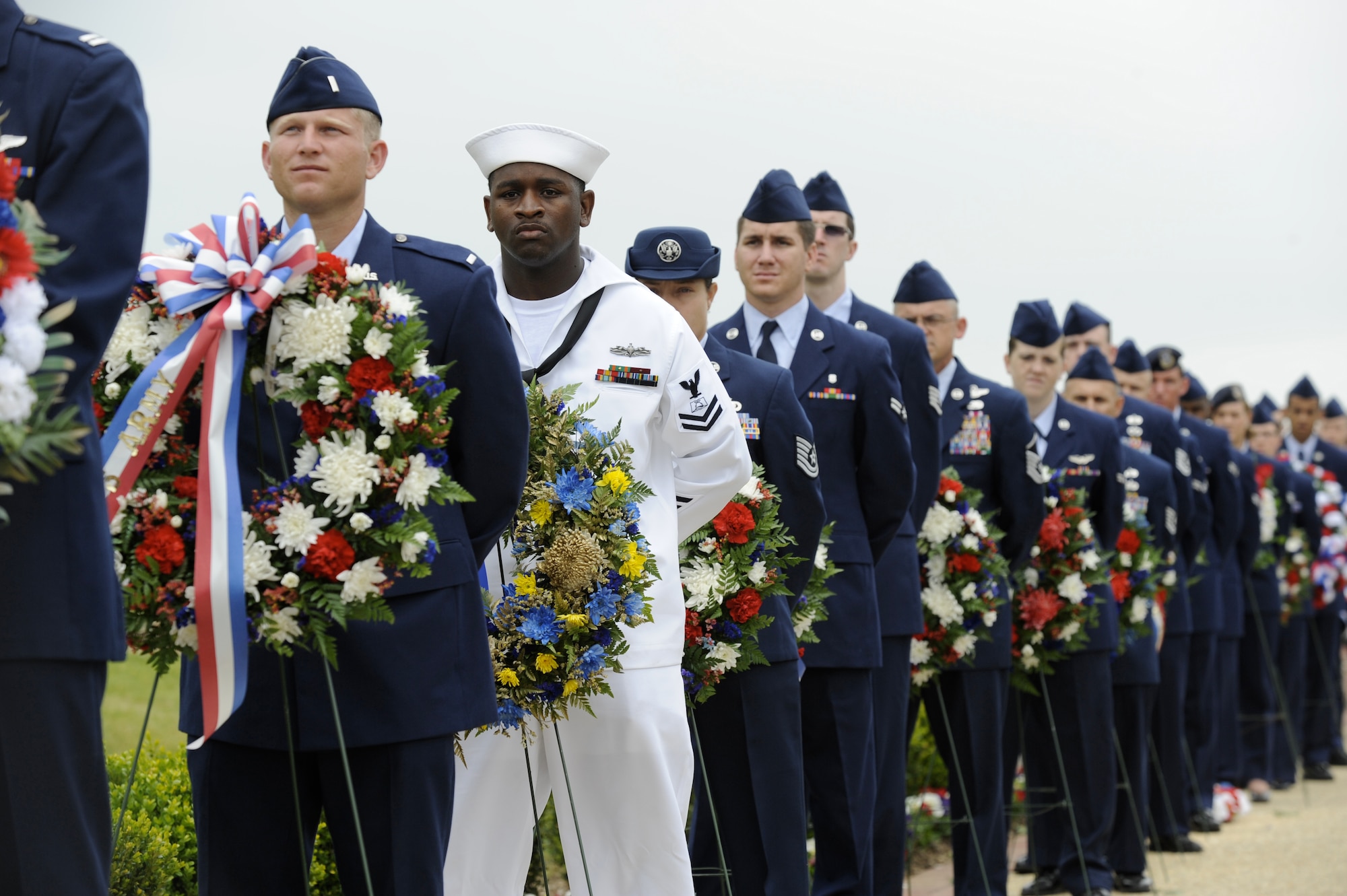 Military personnel participate in the 2010 Parade of Wreaths Ceremony at Pudgy Circle May 27 here. The ceremony included civic leaders, members from all branches of the military and members from state and local police agencies. (U.S. Air Force photo/Carlos Cintron)