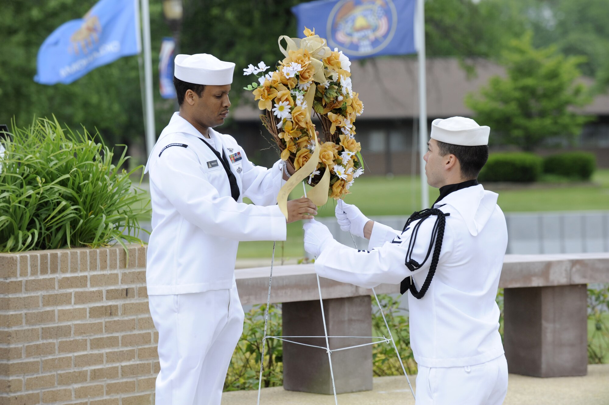 Joint servicemembers, civilians and police officers participate in the Parade of Wreaths Ceremony at Pudgy Circle May 27 here. The event is held annually in observance of Memorial Day and honors those who paid the ultimate sacrifice while serving their country. (U.S. Air Force photo/Carlos Cintron)