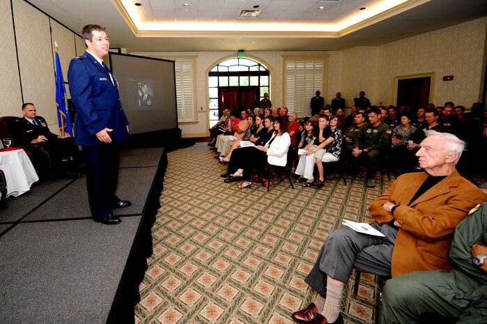 U.S. Air Force Lt. Col. Jesse Strickland, joined by family, friends and fellow service members, remarks on the experiences of his Air Force career during his retirement ceremony at Joint Base Charleston, S.C., May 27, 2010. In the 22 years he served, Colonel Strickland excelled as command pilot, flying more than 6,500 hours in the T-37B, T-38A, C-141A and C-17A aircraft. (U.S. Air Force photo by James M. Bowman/Released)