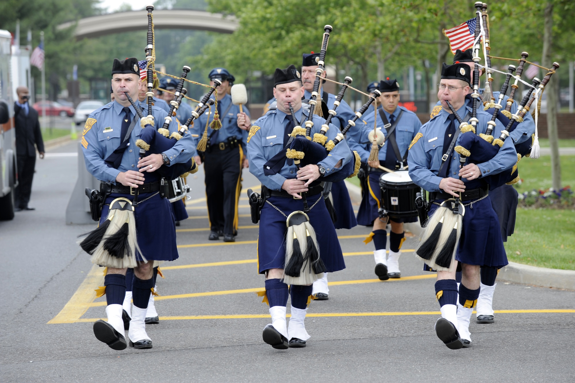 Members of the New Jersey State Police Pipes and Drums of Blue and Gold march while playing music during the Parade of Wreaths Ceremony at Pudgy Circle May 27 here. The event is held annually in observance of Memorial Day. (U.S. Air Force photo/Carlos Cintron)