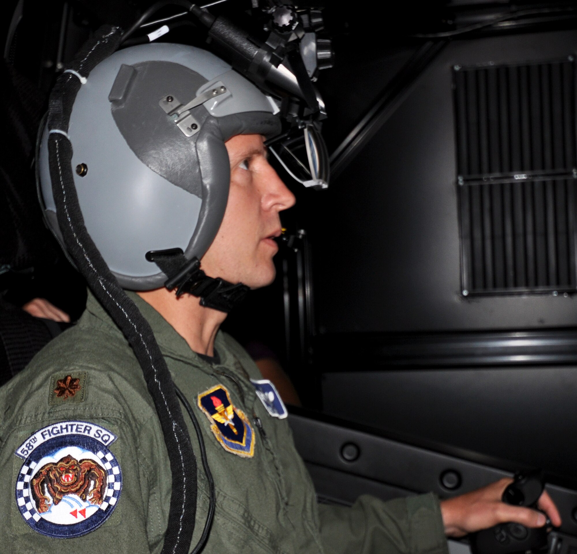 Maj. Eric Smith, 58th Fighter Squadron assistant operations director, flies the 33rd Fighter Wing mission rehearsal trainer for the F-35 during a demonstration May 27. The trainer will use state of the art technology to further familiarize students with the Joint Strike Fighter. (Air Force Photo/ Ashley M. Wright).