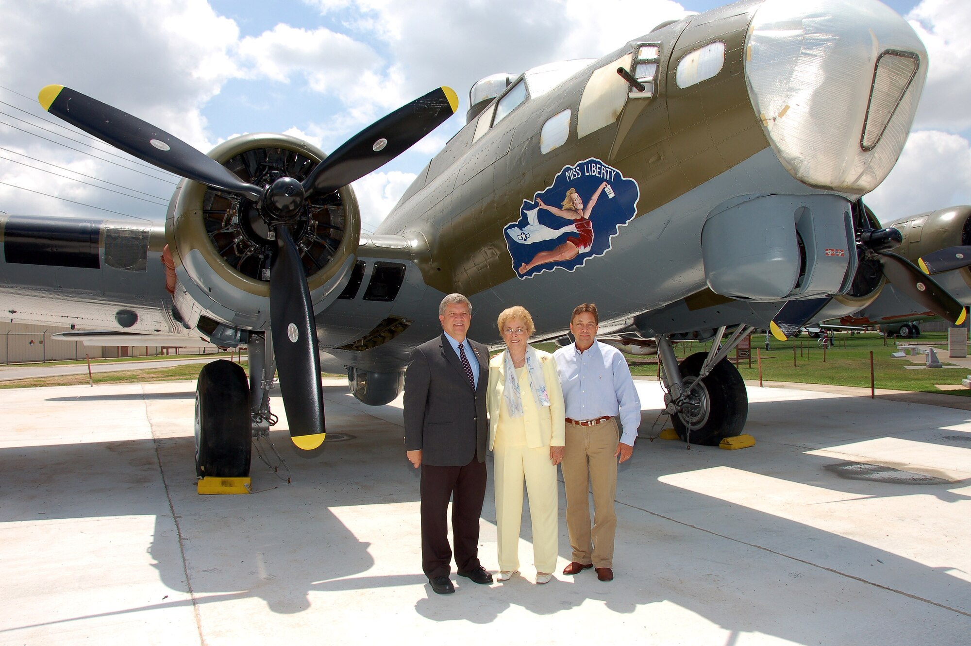 BARKSDALE AIR FORCE BASE, La. - Mildred Taylor-McKeithen and her sons Robert and James Taylor visit a B-17 on display at the 8th Air Force Museum. Mrs. Taylor-McKeithen was presented the Prisoner of War Medal during a ceremony honoring her late husband, Staff Sgt. James Taylor, at the museum on Barksdale Air Force Base May 21. Sergeant Taylor served as a B-17 waist gunner during World War II and was held prisoner by the Germans for eight months during the war. (U.S. Air Force photo/Maj. Richard Komurek)