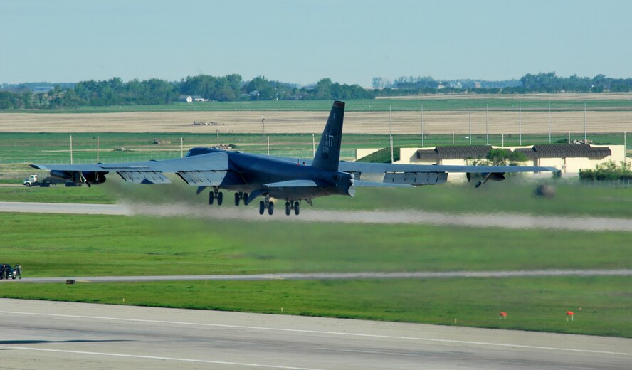 MINOT AIR FORCE BASE, N.D. -- A B-52H Stratofortess takes off on its way to Andersen AFB, Guam, as part of a deployment here Jun 2. During the six-month deployment, nearly 350 Airmen and more than five B-52s will provide U.S. Pacific Command with a continuous bomber presence in the Asia-Pacific region. (U.S. Air Force photo by Staff Sgt. Miguel Lara III)