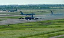 MINOT AIR FORCE BASE, N.D. – A group of B-52H Stratofortesses taxi for takeoff on their way to Andersen AFB, Guam, as part of a deployment here Jun 2. During the six-month deployment, nearly 350 Airmen and more than five B-52s will provide U.S. Pacific Command with a continuous bomber presence in the Asia-Pacific region. (U.S. Air Force photo by Staff Sgt. Miguel Lara III)