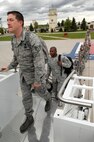 MINOT AIR FORCE BASE, N.D. -- Airmen from the 5th Bomb Wing board a Boeing 767 on their way to Andersen AFB, Guam, here May 31. The 5th BW is part of deployment rotation that provides U.S. Pacific Command with a continuous bomber presence in the Asia-Pacific region. (U.S. Air Force photo by Senior Airman Michael J. Veloz)