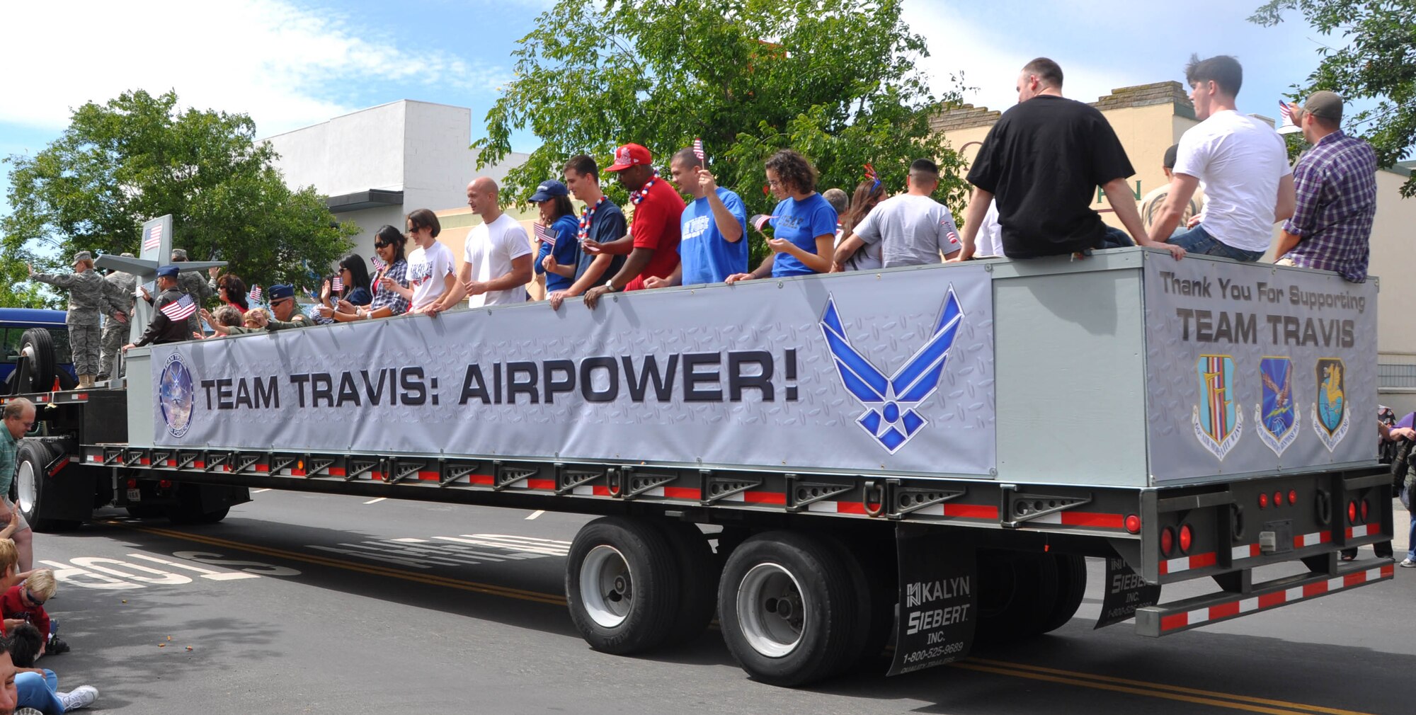 Team Travis members and their families ride on the Travis float at the Rio Vista Memorial Day parade May 31. (Senior Airman Kristen Rohrer)