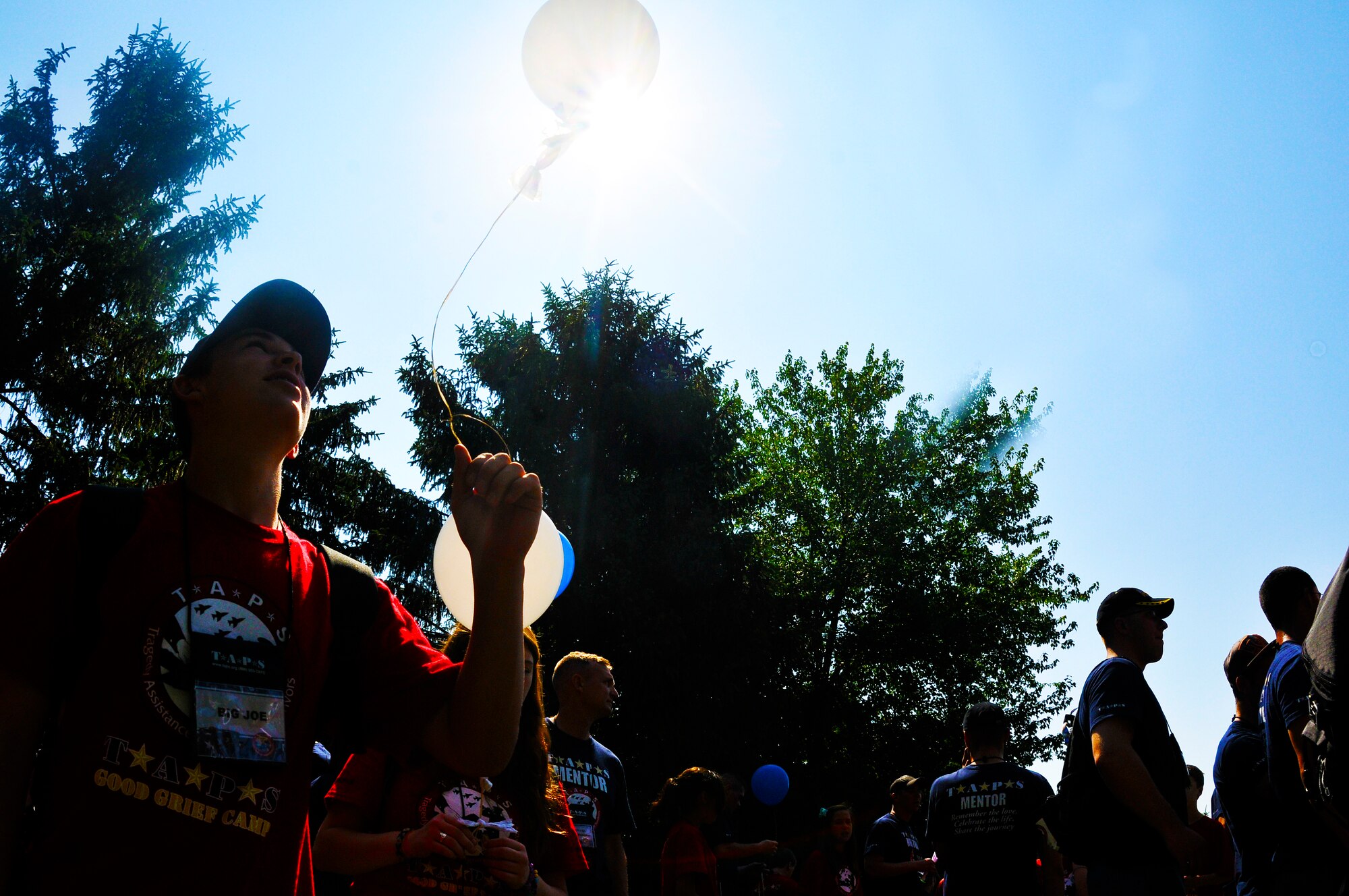Mentees prepare to release their balloons during the 16th annual Tragedy Assistance Program for Survivors National Military Survivor Seminar and Good Grief Camp May 30. Children wrote hand-written messages to their lost loved ones in a special act during the camp. Since 1995, adults have attended the annual National Military Survivor Seminar and children attend the annual National Good Grief Camp. Both programs incorporate a series of activities and workshops to help the attendees cope with the grief that comes with losing a loved one. (U.S. Air Force photo by Airman 1st Class Katherine Windish)