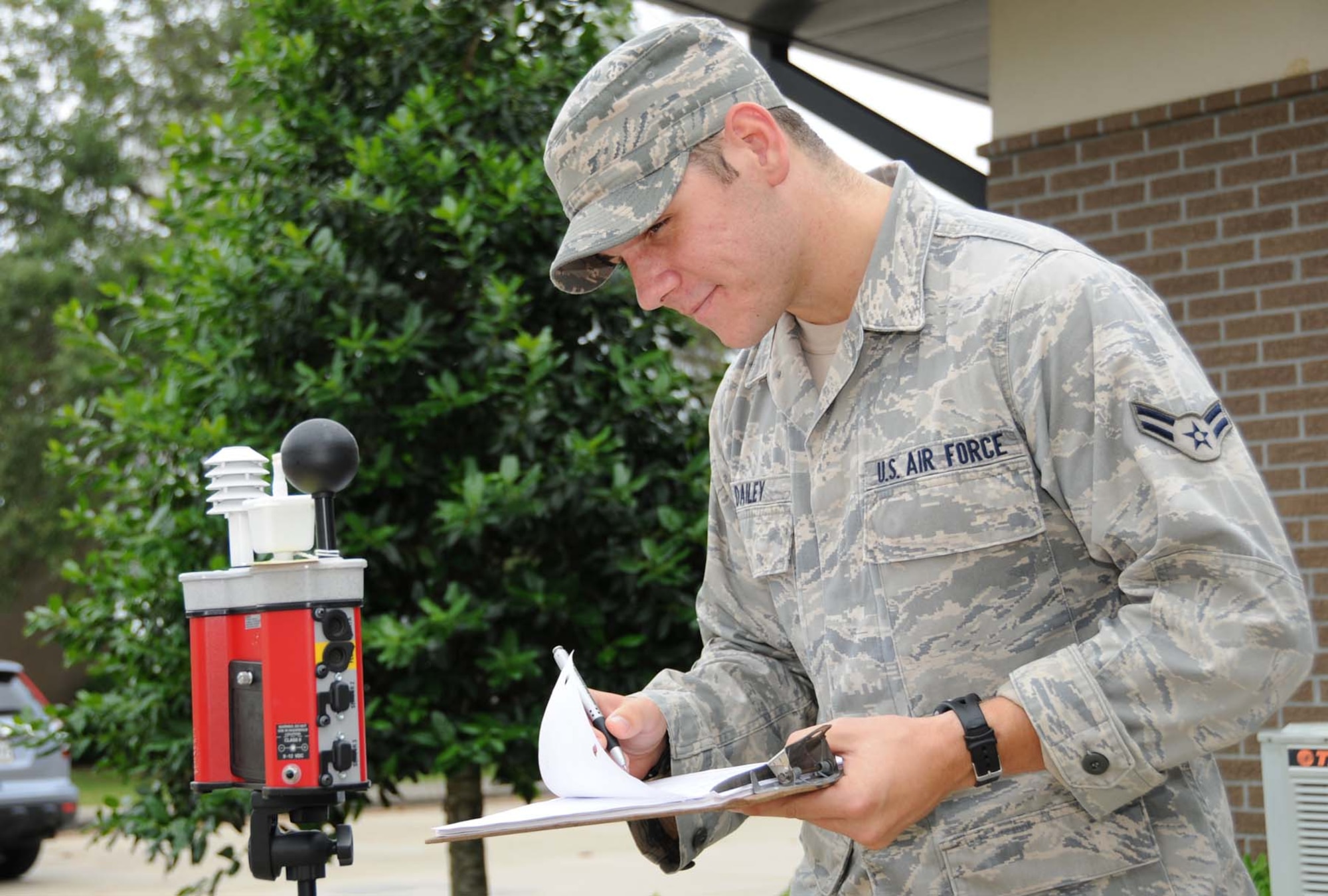 Airman 1st Class Andrew Dailey, 81st Aerospace Medicine Squadron, performs a wet bulb globe temperature reading that determines a heat category and work/rest cycles.  (U.S. Air Force photo by Kemberly Groue)