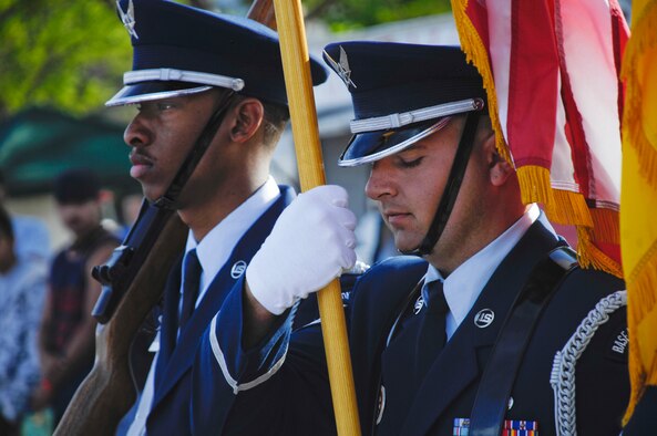 ALAMOGORDO, N.M. -- Senior Airman Oswald Stephenson and Staff Sgt. Chad Eichmeier, both members of the Holloman Air Force Base?s Steel Talon Honor Guard, present the colors at the opening of the Armed Forces Day Celebration May 15, 2010. Following the presentation of the colors, the Steel Talons put on a demonstration for the hundreds of spectators attending the event which was held in the city's Washington Park. (U.S. Air Force photo by Tom Fuller / Released)