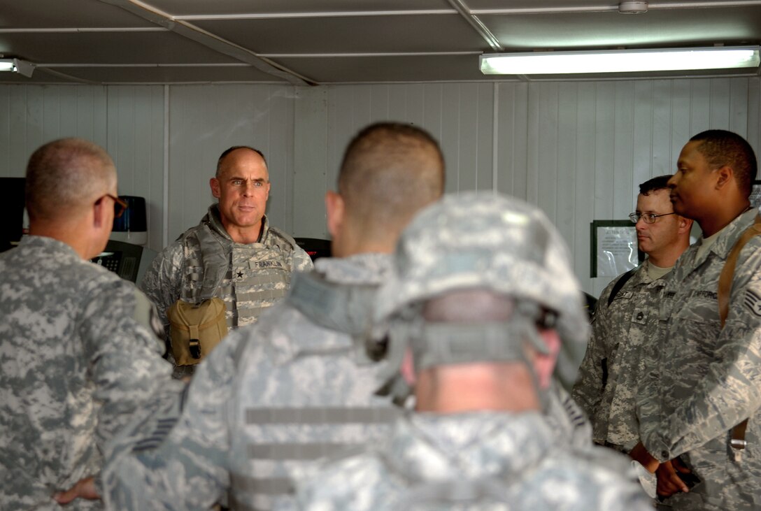 Members of the 732nd Expeditionary Support Squadron Kalsu Provincial Reconstruction Team speak with Brig. Gen. Craig A. Franklin, May 14, 2010, at forward operating base Kalsu, Iraq, about the projects the PRT is taking on as U.S. forces draw down in Iraq. The PRT team is made up of joint expeditionary tasked Airmen, Army and State Department officials. General Franklin is the 332nd Air Expeditionary Wing commander. (U.S. Air Force photo/ Senior Airman Wes Carter) 