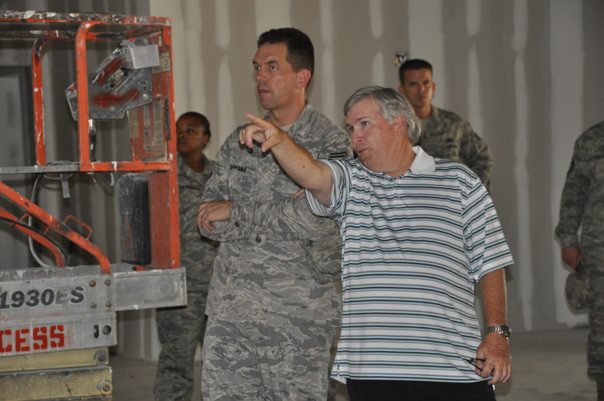 Harry Britts, 325th Civil Engineer Squadron Saber Element chief, shows Chief Master Sgt. Robert Tappana, Air Education and Training Command Command Chief, the new Horizons' Club while in its construction stages May 26 during the Chief's visit to Tyndall Air Force Base. (U.S. Air Force photo/Senior Airman Veronica McMahon)