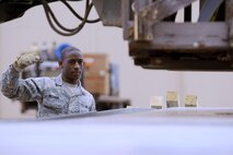 MINOT AIR FORCE BASE, N.D. -- Airman 1st Class Timothy Williams, 5th Logistics Readiness Squadron mobility readiness space packaging technician, guides a forklift with equipment onto a pallet during deployment preparation here May 27. Airmen from the 5th Bomb Wing are deploying to Andersen AFB, Guam, in support of U.S. Pacific Command’s continuous bomber presence in the Asia-Pacific region. (U.S. Air Force photo by Tech. Sgt. Lee A. Osberry, Jr.)