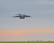 MINOT AIR FORCE BASE, N.D. -- A C-17 Globemaster III full of supplies and equipment for the members of the 5th Bomb Wing deploying to Andersen AFB, Guam, takes off from here May 27. The 5th BW is part of deployment rotation that provides U.S. Pacific Command with a continuous bomber presence in the Asia-Pacific region. (U.S. Air Force photo by Master Sgt. Michael Gaddis)
