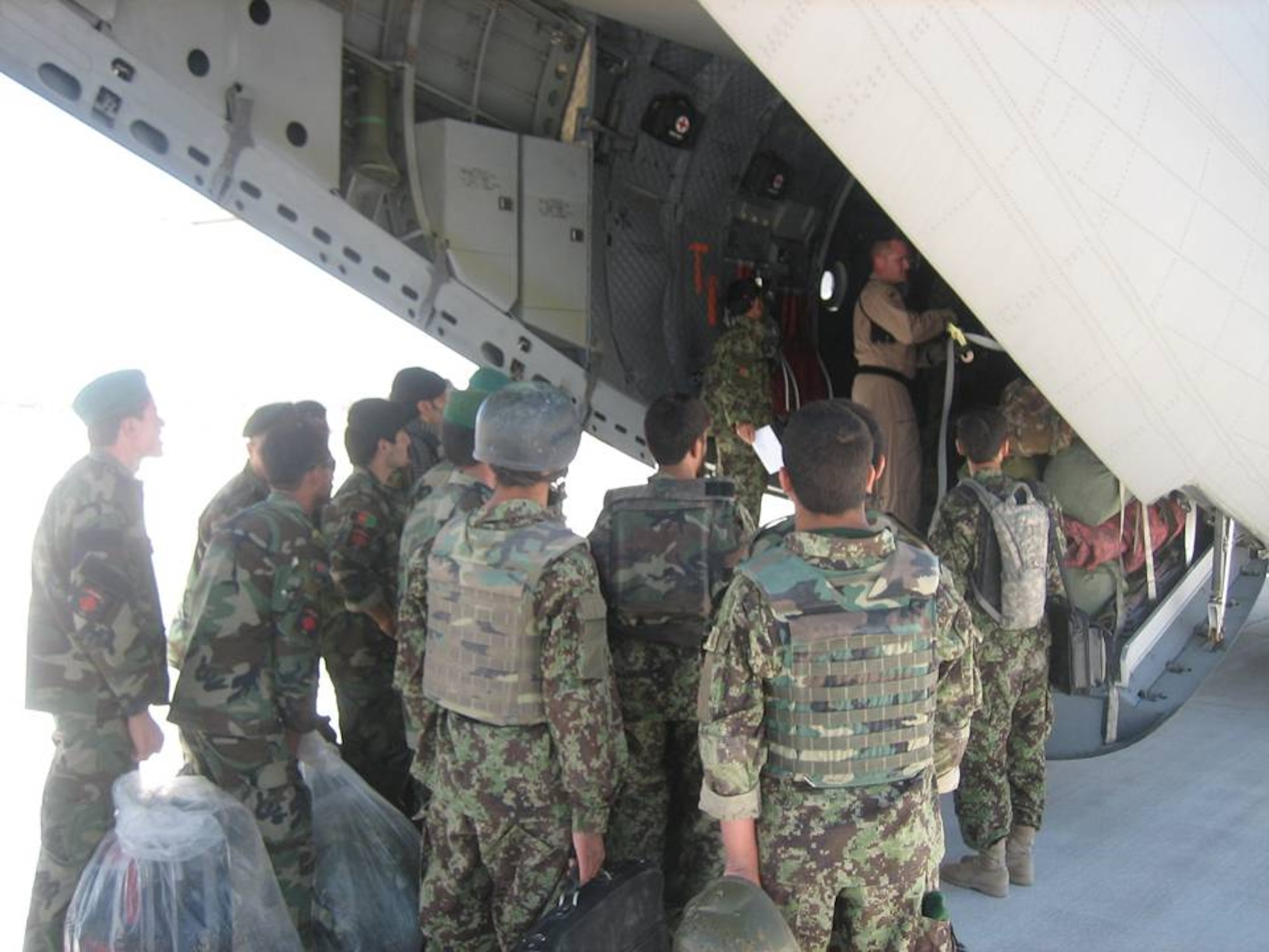 Members of the the Afghan National Army and Afghan Air Corps board a ANAAC C-27 for transport May 29, 2010, between Kabul, Kandahar and Jalalabad. (U.S. military photo/RELEASED)
