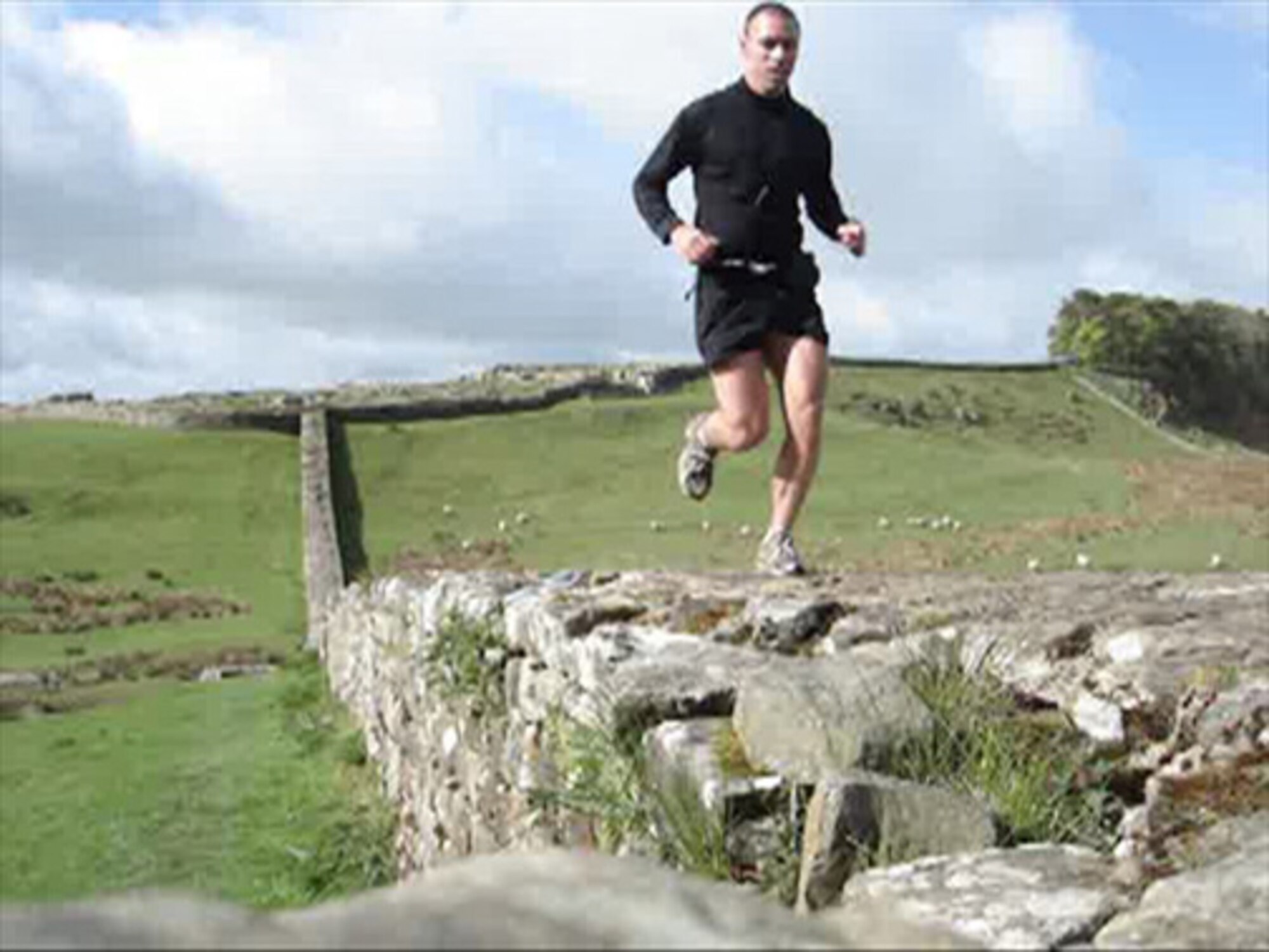 Capt. Danny Franz, 67th Special Operations Squadron, runs the Hadrian's Wall Path May 14. Hadrian's Wall itself is 73 miles long, but the path stretches for 84 miles. It runs along a riverside route in Tyneside, through farmland in Tynedale, Northumberland, and gradually descends to the pastures of Cumbria, before finally ending at the salt marshes of the Solway Estuary. Captain Franz ran the wall in 19 hours and 24 minutes, beating the unofficial record of just over 23 hours. (Courtesy photo)
