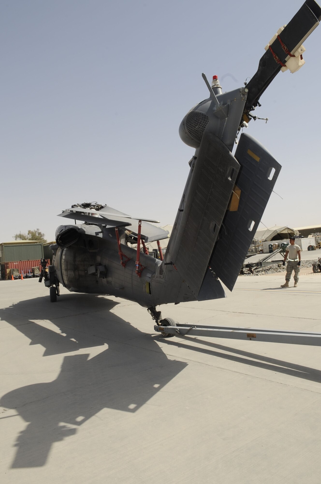 An HH-60G Pave Hawk is being transported into a C-17 Globemaster III May 25 at Kandahar Airfield, Afghanistan.  The helicopter is being taken to another location for routine scheduled maintenance.  (U.S. Air Force photo by Senior Airman Nancy Hooks/Released)
