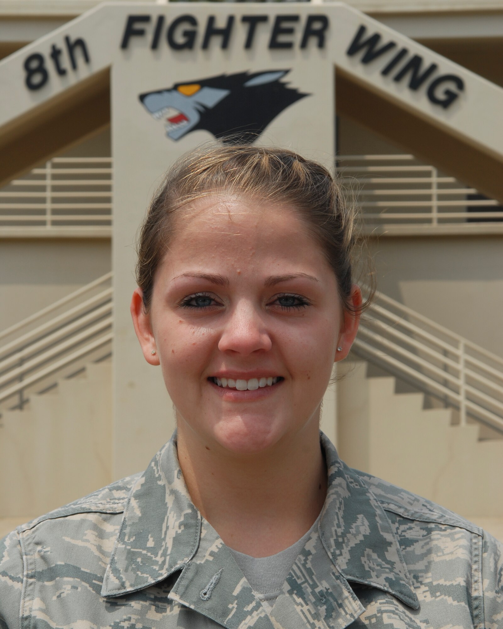 KUNSAN AIR BASE, Republic of Korea -- Senior Airman Jessica Duckett, 8th Fighter Wing command post, stands outside of the Wing building May 26. Airman Duckett was recognized as the top U.S. Air Force Command Post Airman of the Year for 2009. (U.S. Air Force photo/Senior Airman Roy Lynch)