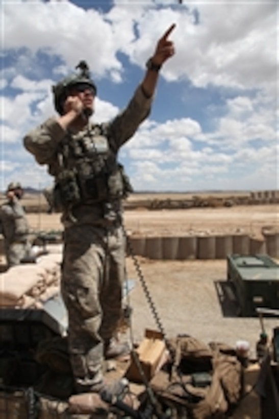U.S. Air force Tech. Sgt. Luke Smith calls for air support at Combat Outpost Jaghato, Afghanistan, on May 20, 2010.  Smith is assigned to 9th Support Operation Team.  