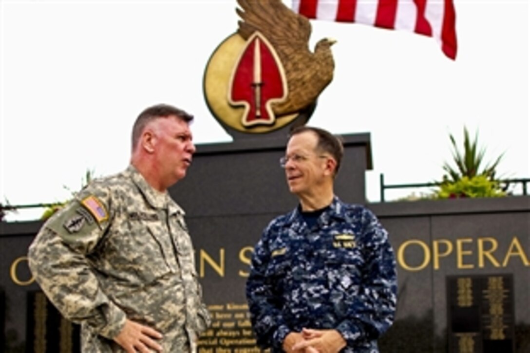 Army Lt. Gen. John F. Mulholland Jr., commanding general, U.S. Army Special Operations Command, gives a tour of the special operations memorial wall to Navy Adm. Mike Mullen, chairman of the Joint Chiefs of Staff, on Fort Bragg, N.C., June 2, 2010.