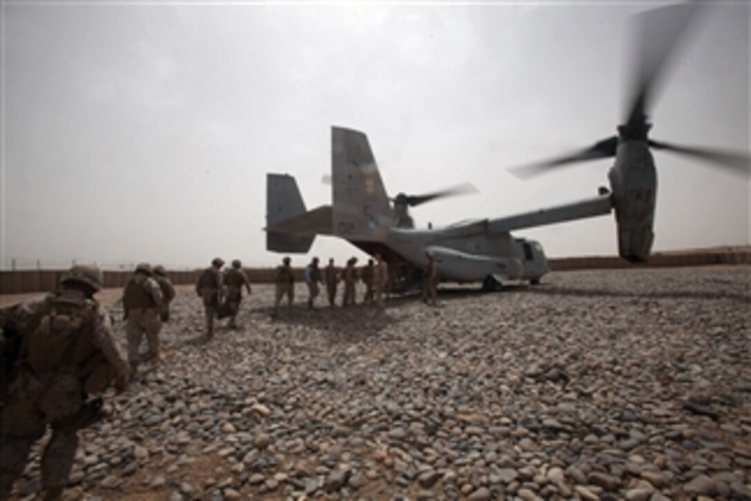 U.S. Marines, sailors and civilians upload onto an MV-22 Osprey aircraft at Forward Operating Base Sher Wali, Afghanistan, on May 22, 2010.  