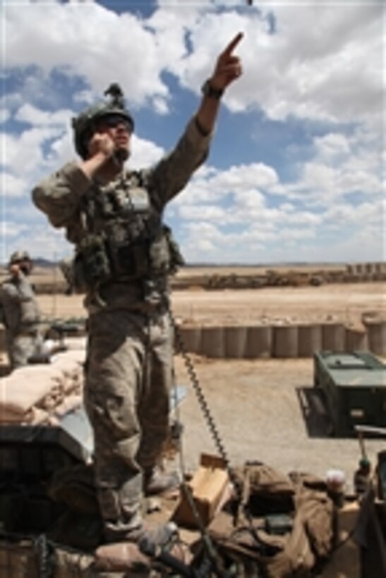 U.S. Air force Tech. Sgt. Luke Smith calls for air support at Combat Outpost Jaghato, Afghanistan, on May 20, 2010.  Smith is assigned to 9th Support Operation Team.  