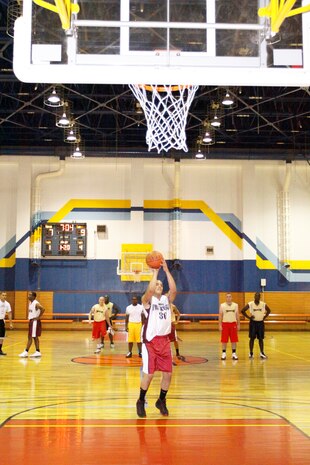 Emmanuel Rosario, point guard for the Diablos, takes a foul shot from the free throw line during an intramural basketball game at the IronWorks Gym here June 2.