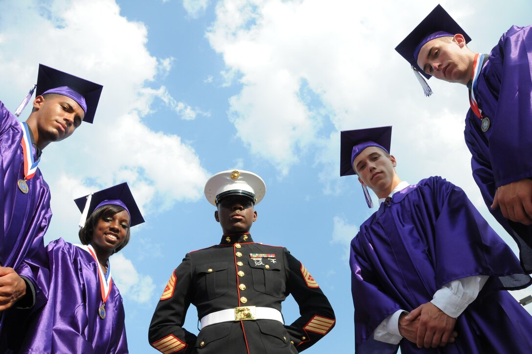 Four students from Fort Worth, Texas-based Crowley High School joined the Marine Corps through the Delayed Entry Program while they still were in school here. Gunnery Sgt. Billy D. Randall, staff noncommissioned officer-in-charge for Recruiting Substation Fort Worth, Recruiting Station Fort Worth is pictured in the center.