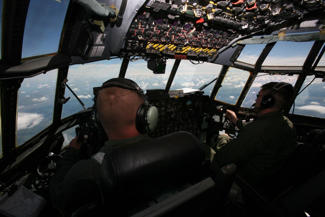 The flightcrew of a Marine Aerial Refueler Transport Squadron 452 KC-130T Hercules pilot toward Romania's Mihail Kogalniceanu Airfield following airborne training with Romanian paratroopers, June 3. Two dozen Marines from VMGR-452, out of Newburgh, N.Y., and VMGR-234, out of Fort Worth, Texas, are currently deployed as the air combat element of the Black Sea Rotational Force Security Cooperation Marine Air-Ground Task Force.