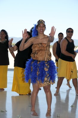 Senior Airman Sarah Fepuleai, a supply management journeyman with the 129th Logistics Readiness Squadron and America-Samoa native, performed a traditional taulaga dance along with members of the Adrian Wilcox High School Polynesian Club at the Asian Pacific American Heritage lunch May 2, 2010 at Moffett Federal Airfield. Asian Pacific American Heritage Month is celebrated in May to commemorate the contributions of people of Asian and Pacific Islander descent in the United States. (Air National Guard photo by Staff Sgt. Kim Ramirez)