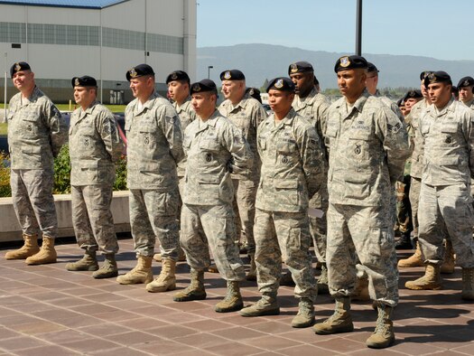 Members of the 129th Security Forces Squadron stand in formation on May 1, 2010 to watch the 129th SFS assumption of command ceremony at Moffett Federal Airfield, Calif. Capt. Thomas Maranda, the former SFS operations officer, is assuming command from Col. Charles Ingalls, the 129th Mission Support Group commander. Colonel Ingalls temporarily held command of Security Forces while Captain Maranda was at technical training to become the SFS commander. (Air National Guard photo by Staff Sgt. Kim Ramirez)