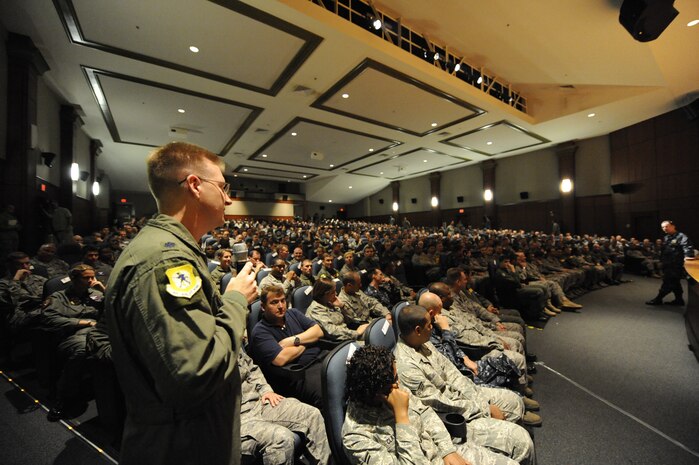 U.S. Air Force Lt. Col. John Donahue asks a question to U.S. Navy Adm. Mike Mullen at the base theater on Joint Base Charleston, S.C., June 3, 2010. During his visit, Admiral Mullen fielded questions from Airmen and addressed Department of Defense policy changes and expectations during an all hands call. Admiral Mullen is the Chairman of the Joint Chiefs of Staff, and Colonel Donahue is the chief of wing plans with the 437th Airlift Wing. (U.S. Air Force Photo/James M. Bowman)
