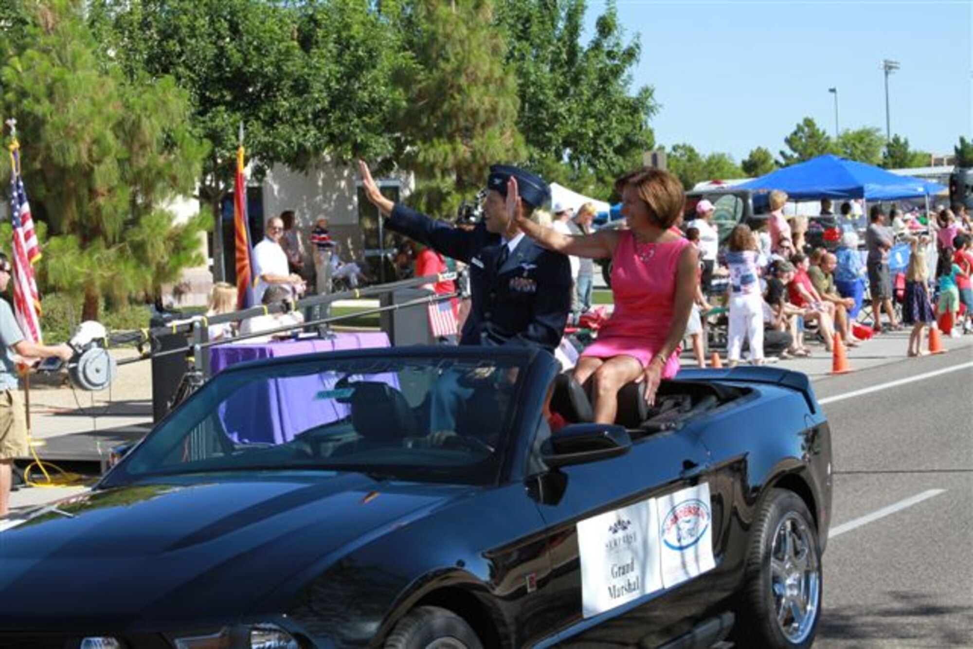Col. Mark Holland, 56th Medical Group commander, and his wife Kathy, ride in the City of Surprise 4th annual Memorial Day Parade.  Holland represented the Air Force and Luke AFB as the Grand Marshal, Saturday, May 29th.  The parade honored those who have fallen, those who have served and those who are still serving our country.