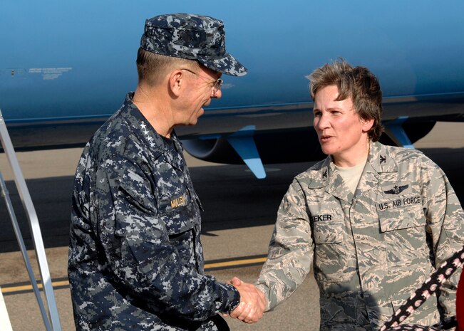 U.S. Navy Adm. Mike Mullen is greeted by U.S. Air Force Col. Martha Meeker on the flightline at Joint Base Charleston, S.C., June 2, 2010. During his visit Admiral Mullen presented three Airmen with Bronze Star Medals, fielded questions from junior ranking Airmen and addressed Department of Defense policy changes and expectations during an all-hands call.  Admiral Mullen is the Chairman of the Joint Chiefs of Staff, and Colonel Meeker is the 628th Air Base Wing commander.  (U.S. Air Force photo/Senior Airman Timothy Taylor)