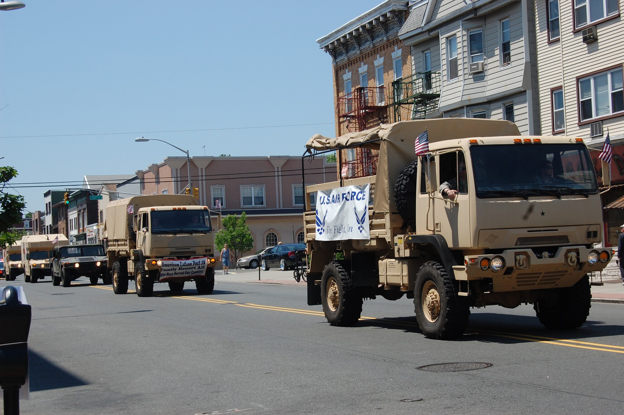 A 421st Combat Training Squadron tactical support truck leads the way for the 421 Scorpion convoy representing the Air Force and USAF Expeditionary Center in the 92nd Bayonne, N.J., Memorial Day parade May 31.The 421st drove three vehicles to participate in the parade, which was dedicated to service members who served in the Korean War. (Photo by Lt. Col. Laura Lenderman)
