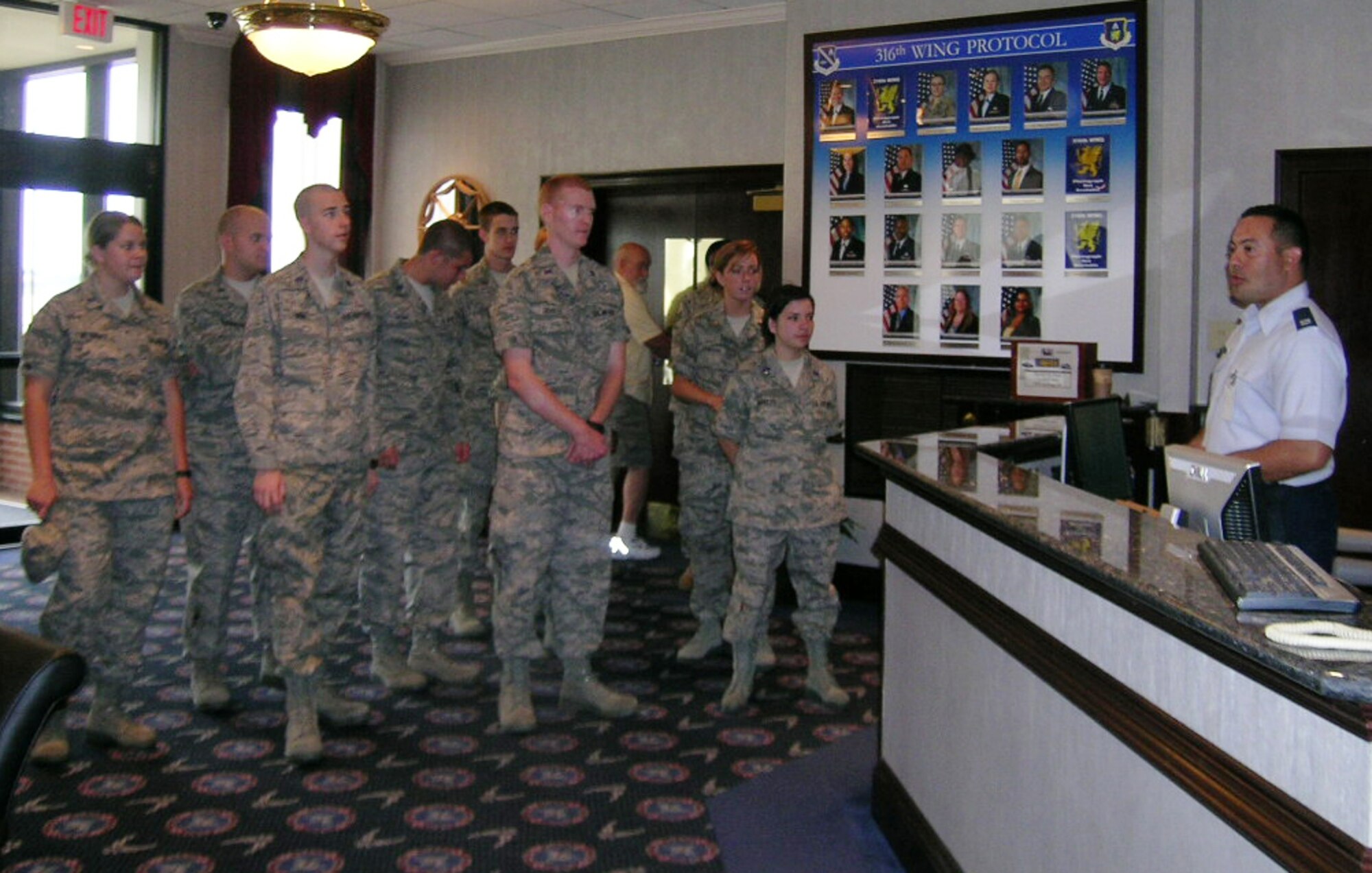 316th Wing Protocol Officer, Captain Nestor Jimenez, explains that the Andrews Distinguished Visitor Lounge plays host to heads of state, religious leaders and senior military leaders. His audience consists of 12 ROTC cadets touring various AFDW units for two weeks starting June 2 as part of a program designed to expose them to the active duty Air Force. 