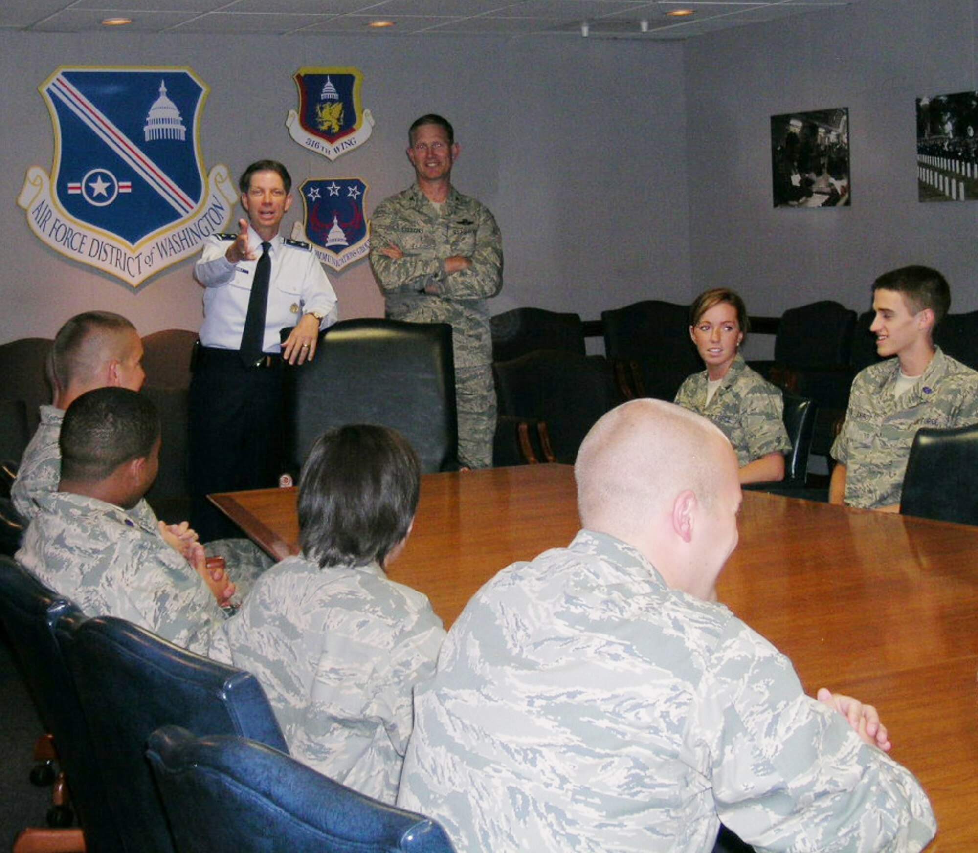 AFDW Commander Maj. Gen. Darrell D. Jones fields questions from 12 ROTC cadets during a meeting at the Wolffe Conference Center at AFDW HQ, Andrews AFB, Md. The cadets are touring various AFDW units for two weeks starting June 2 as part of a program designed to expose them to the active duty Air Force. General Jones, who was an ROTC cadet himself, advised the cadets to look at every assignment as an opportunity. 