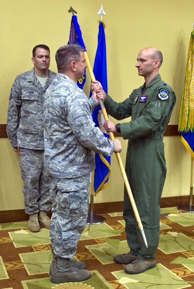 Lt. Col. David G. Austin (right), 605th Test and Evaluation Squadron, accepts the squadron’s guidon from 505th Command and Control Wing Commander Col. Edward L. McKinzie during a change of command ceremony held  May 27 at Hurlburt Field, Fla. Austin was serving as the 605th TES Director of Operations and assumed command from Lt. Col. David Lunger. A 505th CCW subordinate unit, the squadron’s 140 members are respon¬sible for operational testing of Airborne Warning and Control System, Joint Surveillance and Attack Radar System, Control and Reporting Center, Air and Space Operations Center, Tactical Air Control Party and Distributed Common Ground System weapons systems. The 605th TES is headquartered at Hurlburt Field with two detachments and three operating locations in five states. (U.S. Air Force photo by Arnaldo Fonseca)