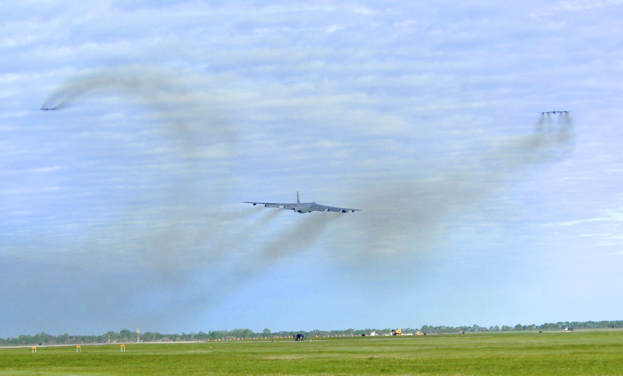 Three B-52H Stratofortesses take off on their way to Andersen Air Force Base, Guam, as part of a deployment June 2, 2010, at Minot Air Force Base, N.D. During the six-month deployment, nearly 350 Airmen and more than five B-52s will provide U.S. Pacific Command with a continuous bomber presence in the Asia-Pacific region. (U.S. Air Force photo/Senior Airman Michael J. Veloz)