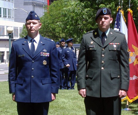 Lt. Col. Doug Ottinger, (left) and his son, Private 1st Class Christopher Ottinger participate in the 11th Annual Veterans Memorial Day Tribute on May 29. Airmen from ARPC and the 310th Mission Support Group were amongst the volunteers who gathered in Denver to honor and recognize fallen veterans and their family members. (U.S. Air Force photo/Cindy Dewey)