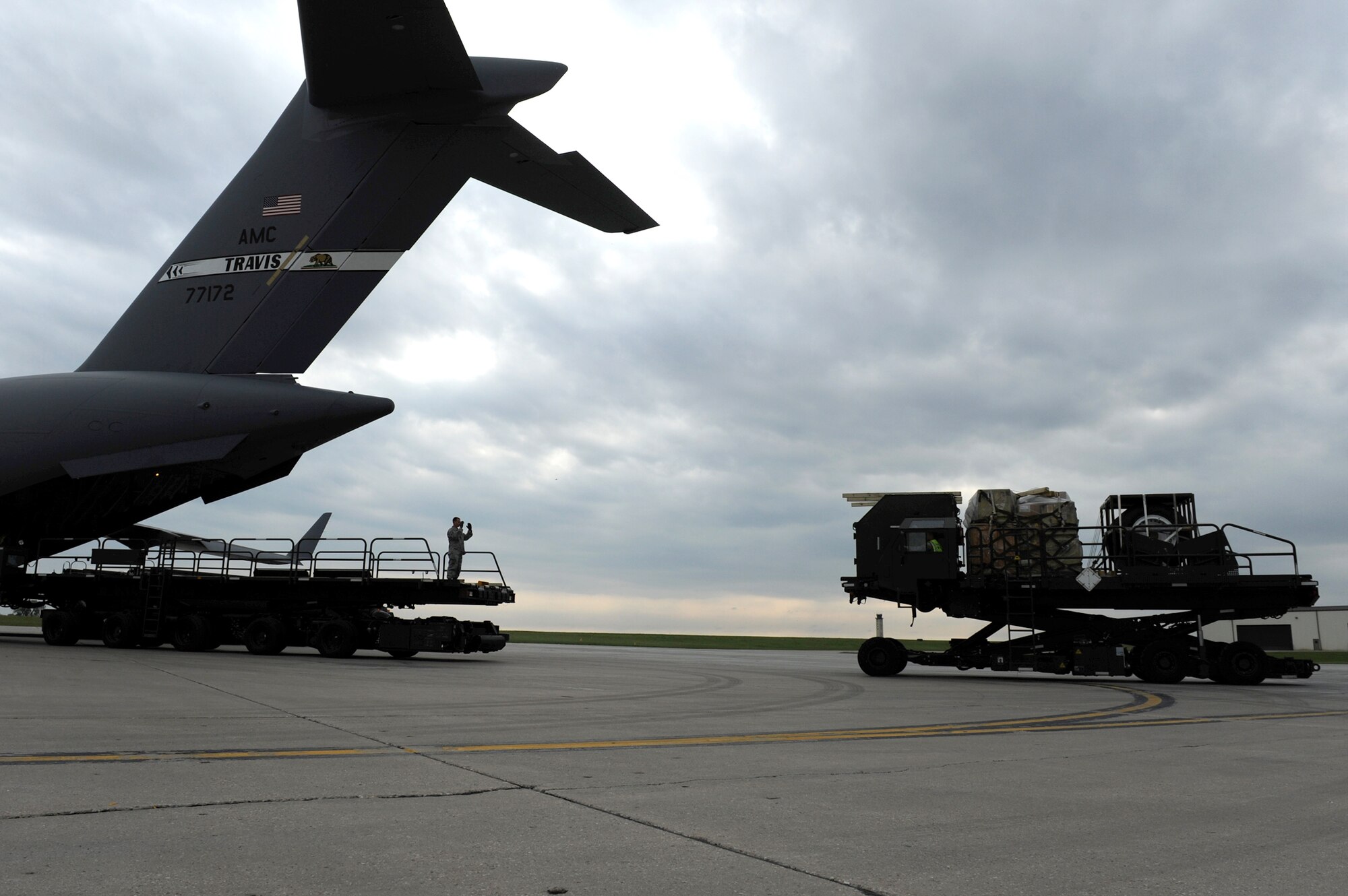Airmen from the 5th Logistics Readiness Squadron load pallets of equipment onto a C-17 Globemaster III out of Travis Air Force Base, Calif., during deployment preparation May 27, 2010, at Minot Air Force Base, N.D. Airmen from the 5th Bomb Wing are preparing to deploy to Andersen Air Force Base, Guam, in support of U.S. Pacific Command's continuous bomber presence in the Asia-Pacific region. (U.S. Air Force photo/Tech. Sgt. Lee A. Osberry Jr.)