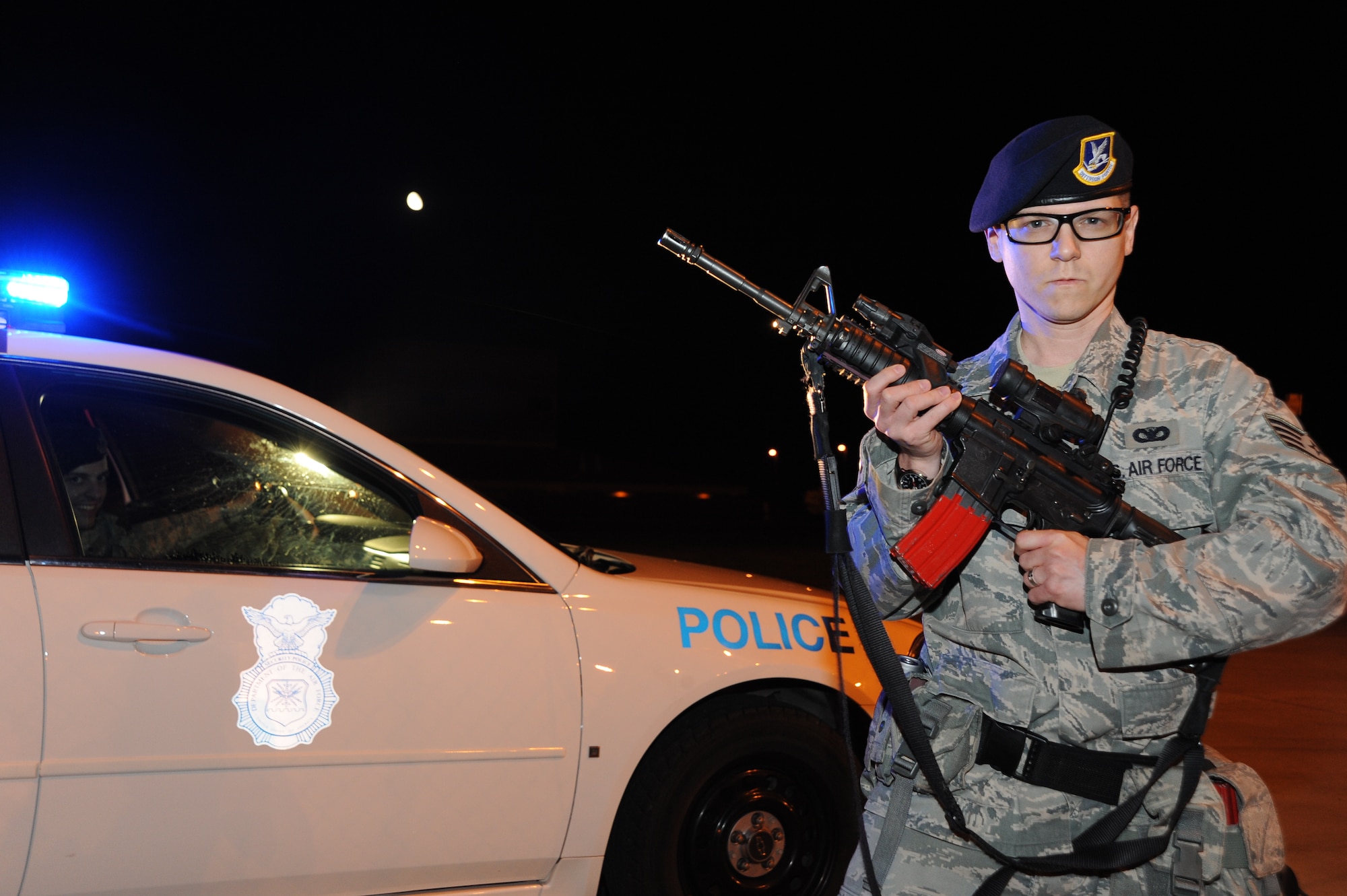 Staff Sgt. William Roberts, 22nd Security Forces Squadron patrolman, stands at the ready position watching for suspicious activity at the McConnell flightline entry control point, June 2, 2010, McConnell Air Force Base, Kan.  The 22nd SFS has one of the highest deployment rates in the Air Force with an one-to-one dwell ratio.  Despite frequent deployments, the 22nd SFS continues to protect the base and the assets.  (U.S. Air Force photo/Tech. Sgt. Chyrece Campbell)